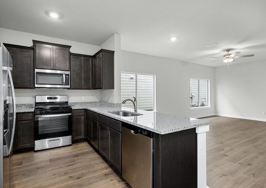 The kitchen has sprawling granite countertops.