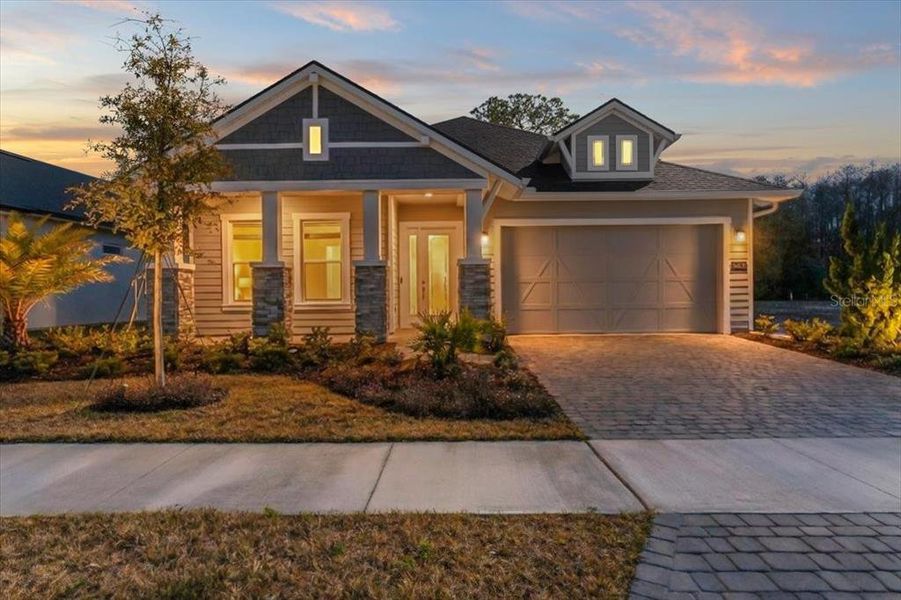 Front exterior of a new home in Woodhaven, Port Orange, FL, highlighting curb appeal (Image 28). Front exterior of a new home in Woodhaven, Port Orange, FL, highlighting curb appeal (Image 28).