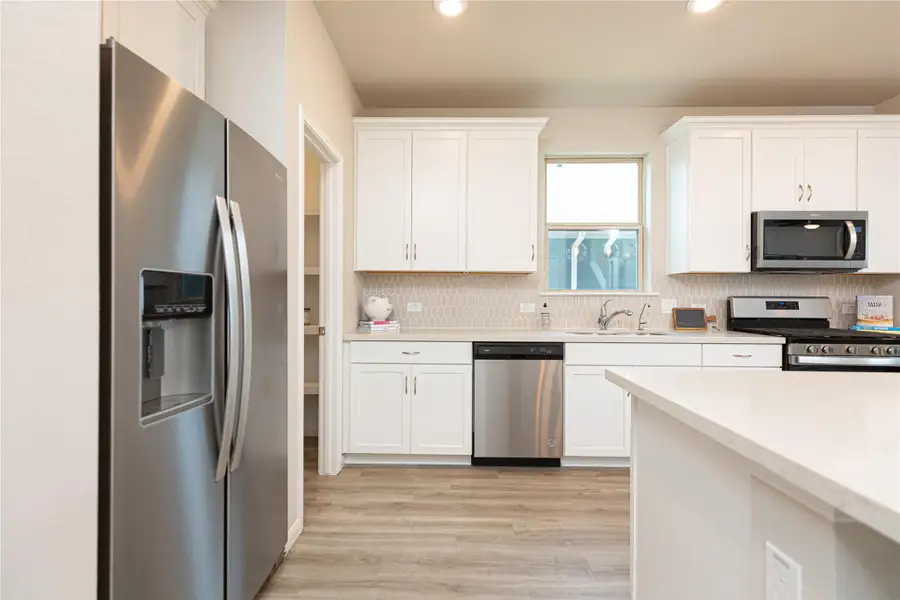 Sample photo of completed home with similar plan. As-built color and selections may vary.