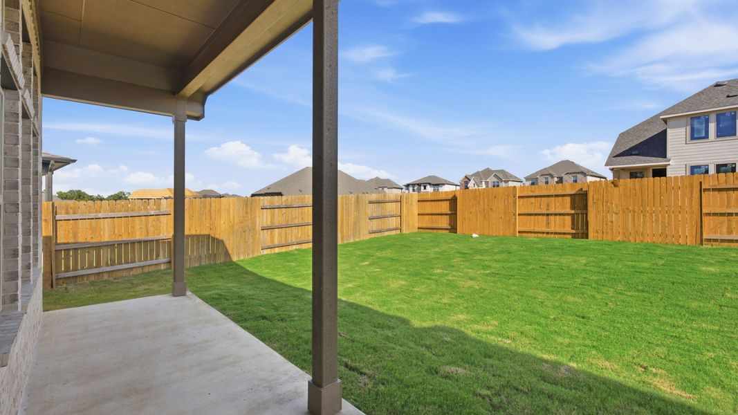 Exterior details and patio area of a home in Oaks at San Gabriel, Georgetown (Image 21).