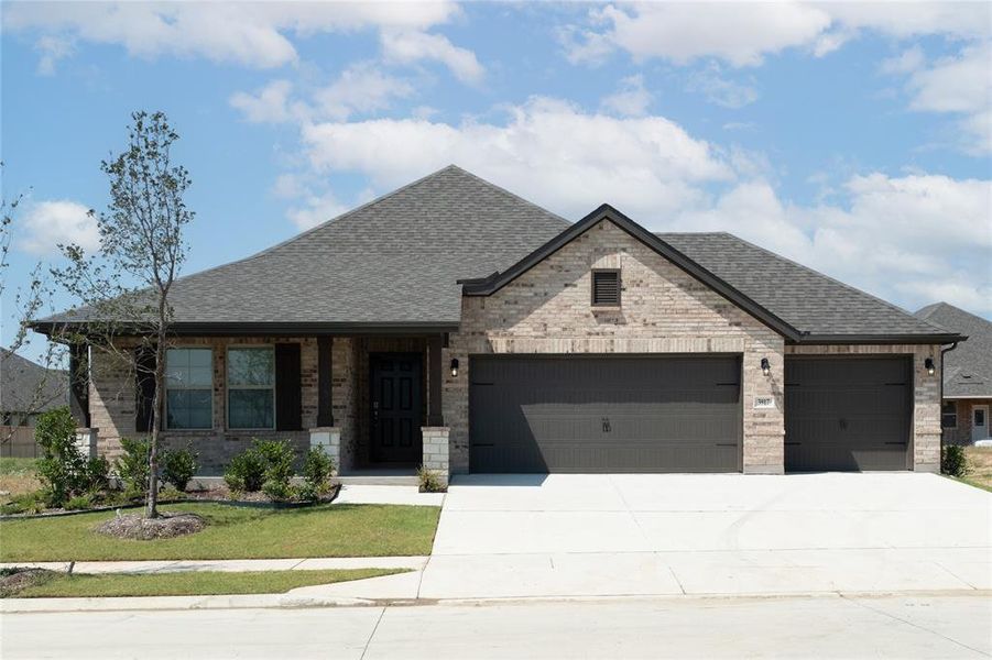 Front exterior of a new home in Goodland: Overlook 60', Midlothian, TX, highlighting curb appeal (Image 14).