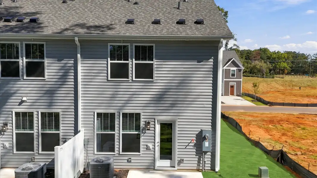 Vibrant home rear exterior in a thoughtfully planned community near city conveniences by DRB Homes