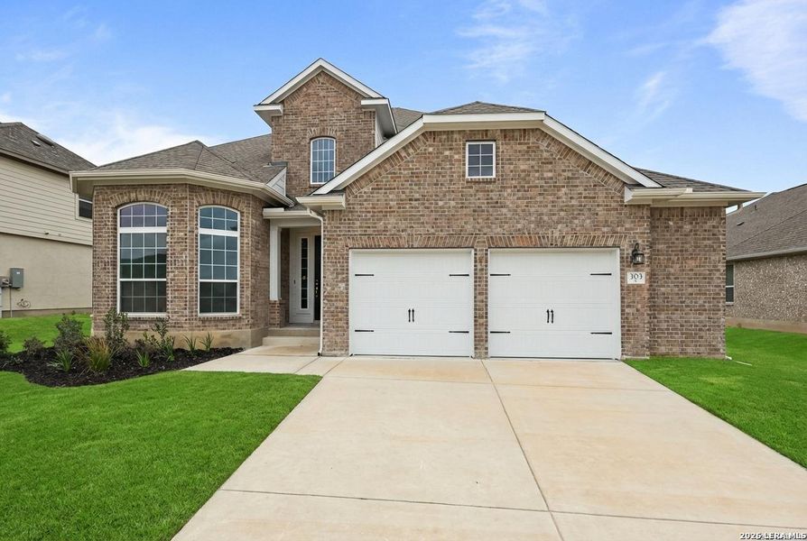 Front exterior of a new home in Buffalo Crossing, Cibolo, TX, highlighting curb appeal (Image 2). Front exterior of a new home in Buffalo Crossing, Cibolo, TX, highlighting curb appeal (Image 2).