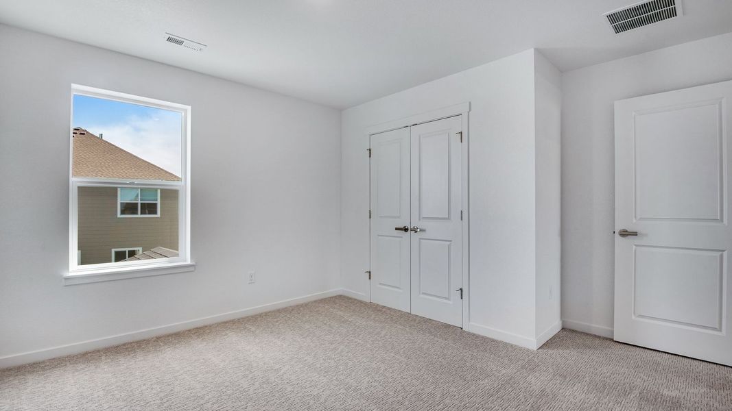 Spacious, unfurnished interior of a new home in Trails at Crowfoot, Parker (Image 44).