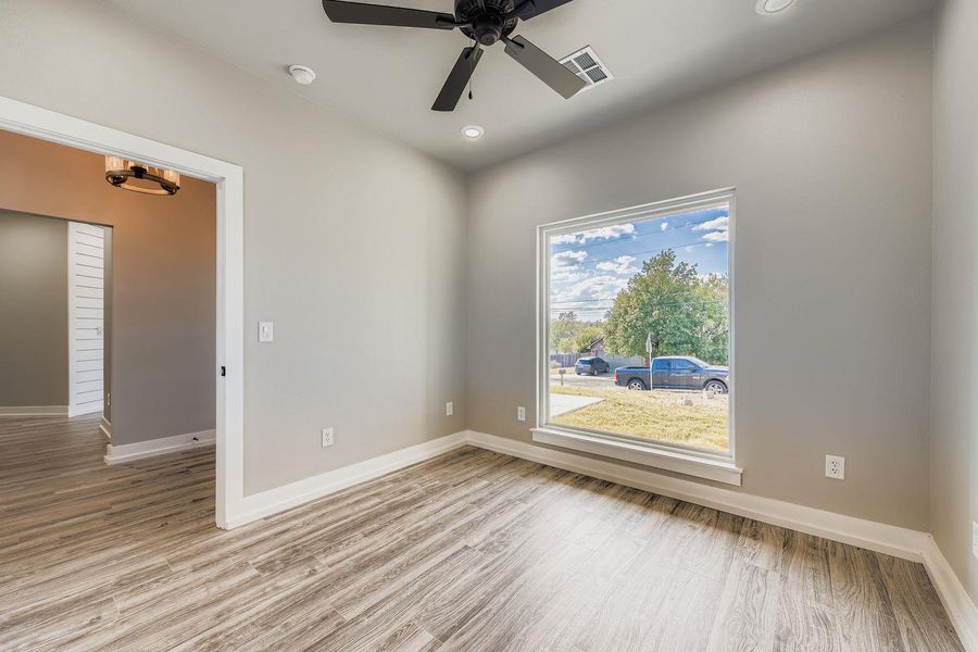 Spare room with light wood-style flooring, recessed lighting, and a ceiling fan