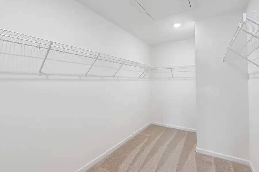 Representative Photo: Primary Bedroom Walk-In Closet