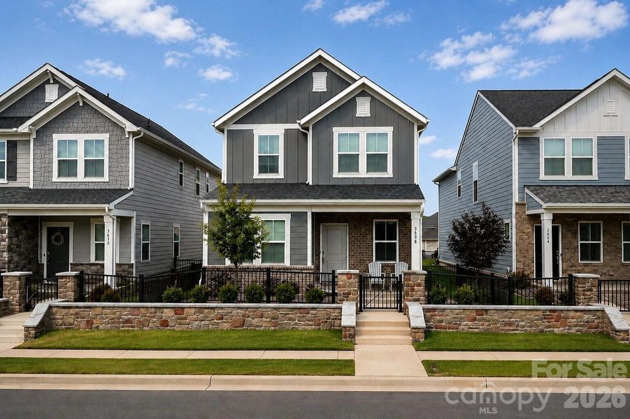 Front exterior of a new home in Riverstone, Monroe, NC, highlighting curb appeal (Image 19).