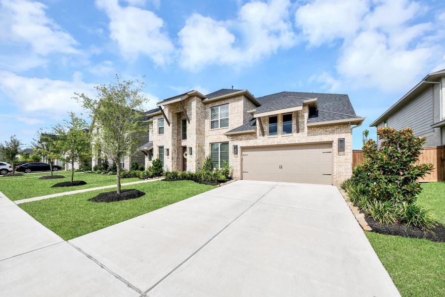 Front exterior of a new home in Legacy Prairie at Katy Court, Katy, TX, highlighting curb appeal (Image 23).
