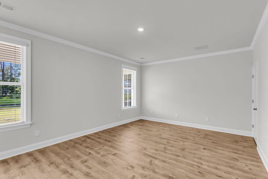 Spacious, unfurnished interior of a new home in Tidewater at Lakes of Cane Bay, Summerville (Image 16).