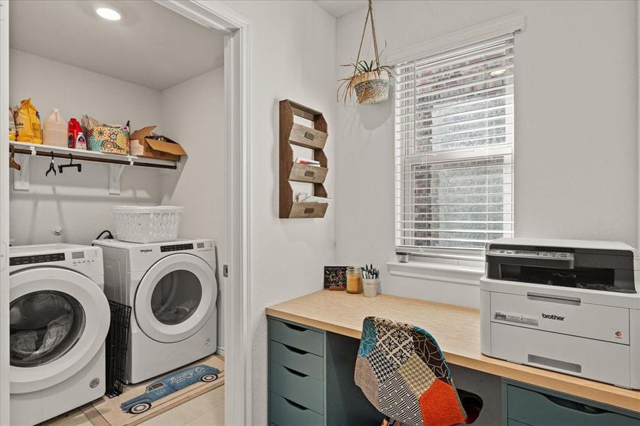 Washroom with tile patterned floors and washer and dryer