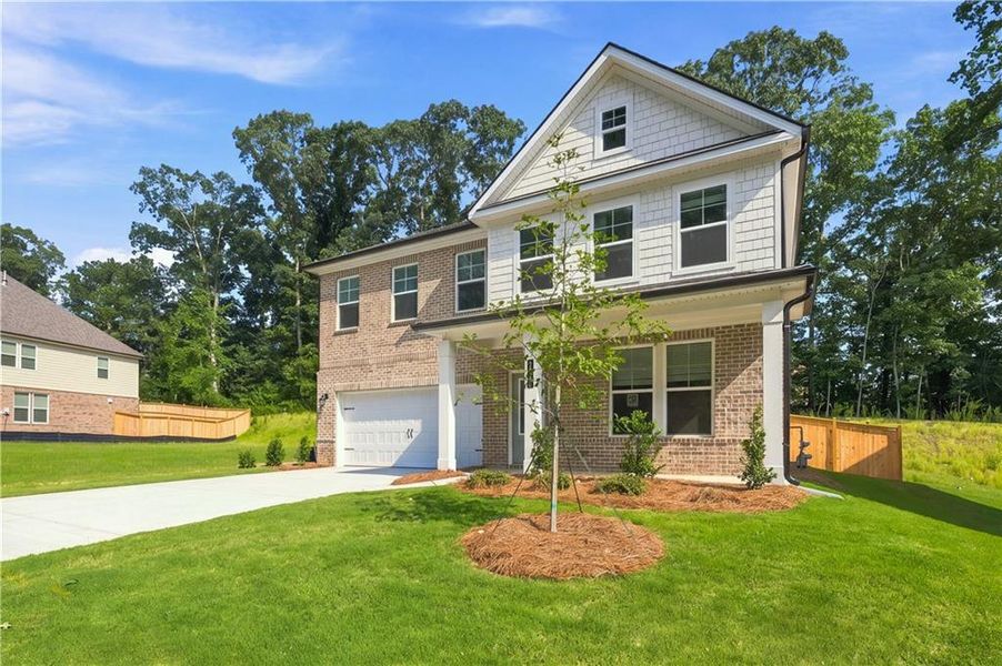 Front exterior of a new home in Hamilton Lakes, Lawrenceville, GA, highlighting curb appeal (Image 1). Front exterior of a new home in Hamilton Lakes, Lawrenceville, GA, highlighting curb appeal (Image 1).