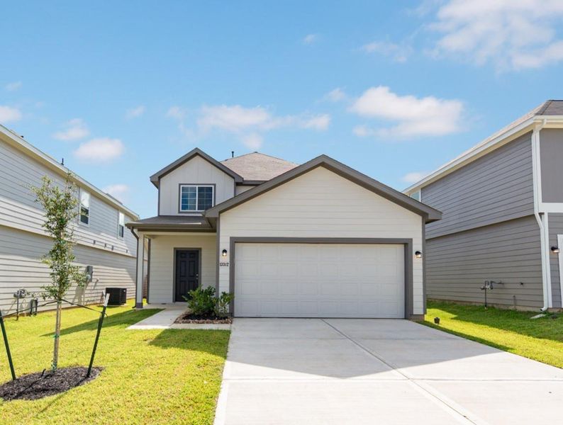 Front exterior of a new home in River's Edge, Conroe, TX, highlighting curb appeal (Image 1). Front exterior of a new home in River's Edge, Conroe, TX, highlighting curb appeal (Image 1).