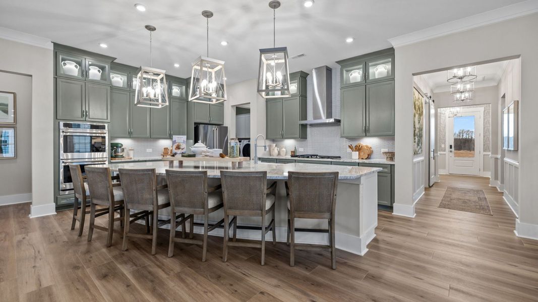 The Inspire Plan by DBR Homes kitchen with an oversized corner island modern cabinets and features in Fort Mill, SC.