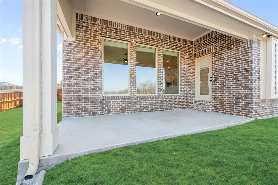 Exterior details and patio area of a home in Villages of Hurricane Creek, Anna (Image 4).