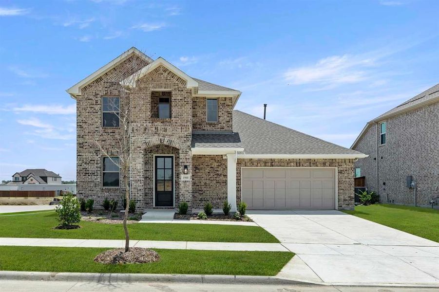 Front exterior of a new home in Brookshire at Legacy Hills-60s, Celina, TX, highlighting curb appeal (Image 1).