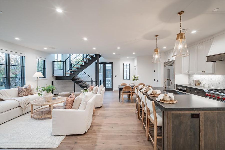 Living room featuring light hardwood / wood-style floors and sink