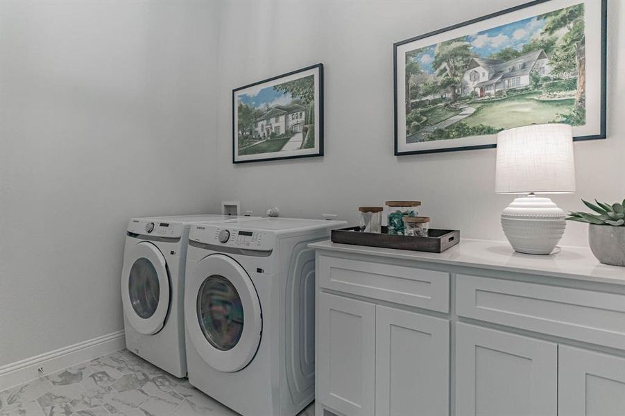 Full size laundry in utility room with cabinets Full size laundry in utility room with cabinets