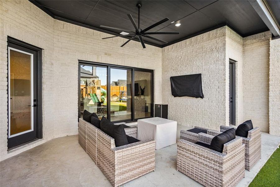 Large covered patio with large fan for summer days