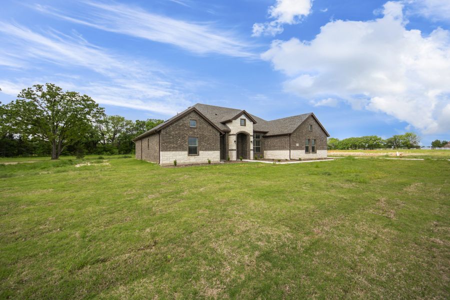 Representative exterior photo of a completed home built from the 2591 by Robbie Hale Homes in High Meadows Estates, Nevada, TX (Image 2).