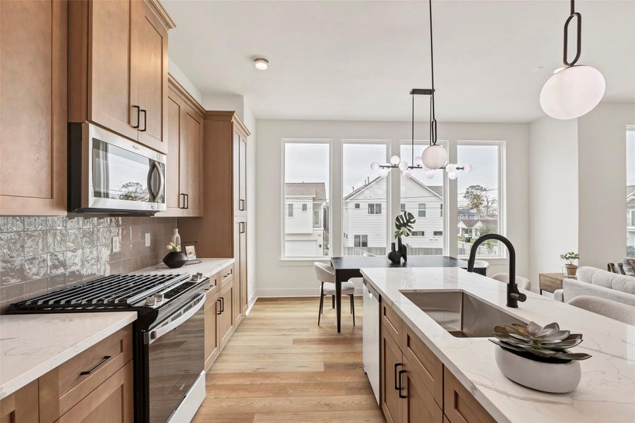 This modern kitchen equipped with sleek, high-end appliances, perfect for cooking and entertaining with ease. This modern kitchen equipped with sleek, high-end appliances, perfect for cooking and entertaining with ease.