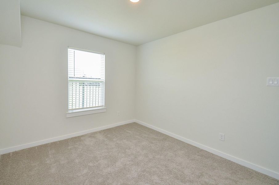 Spacious, unfurnished interior of a new home in Sunterra, Katy (Image 29).