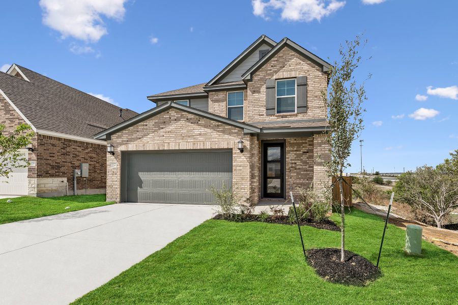 Front exterior of a new home in Mayfair - Select Garden Series, New Braunfels, TX, highlighting curb appeal (Image 21). Front exterior of a new home in Mayfair - Select Garden Series, New Braunfels, TX, highlighting curb appeal (Image 21).