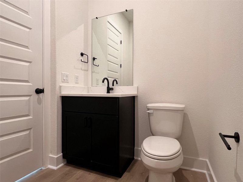 Bathroom with vanity and light wood-type flooring