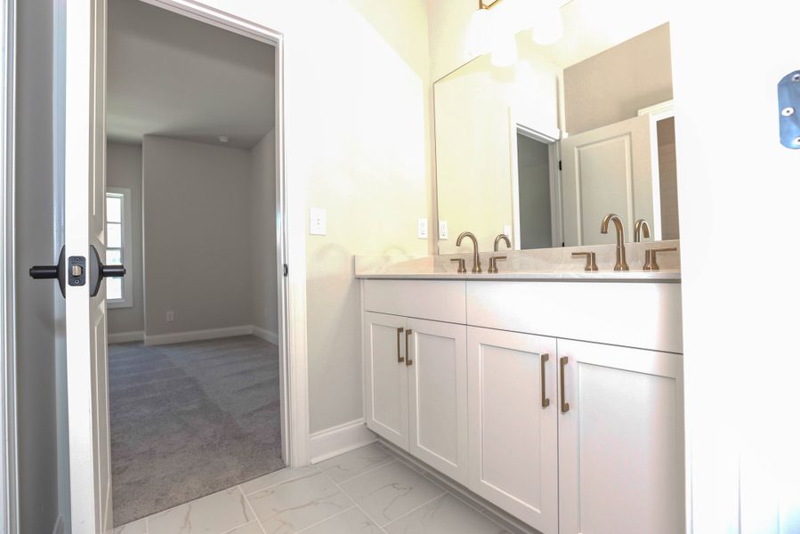 Representative furnished interior of a home built from the The Maddox by The Providence Group in Bellmoore Park, Johns Creek (Image 17).