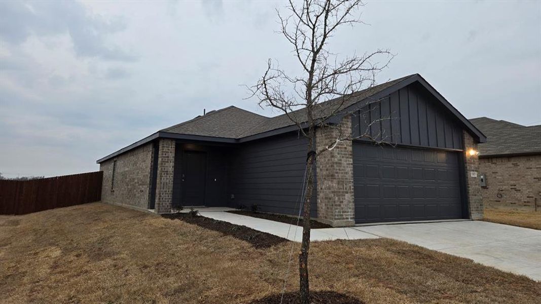 Front exterior of a new home in Leonard Crossing, Leonard, TX, highlighting curb appeal (Image 2). Front exterior of a new home in Leonard Crossing, Leonard, TX, highlighting curb appeal (Image 2).
