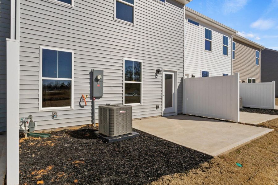 Front exterior of a new home in Bellevue Townhomes, Greenville, SC, highlighting curb appeal (Image 17). Front exterior of a new home in Bellevue Townhomes, Greenville, SC, highlighting curb appeal (Image 17).
