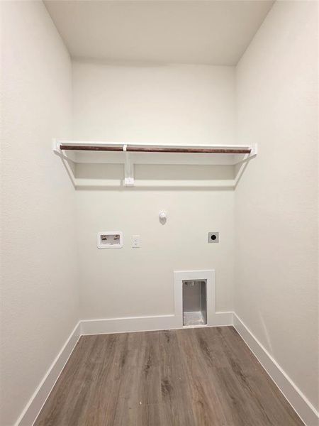 Seperate laundry room and hanging rack for drip dry clothes.