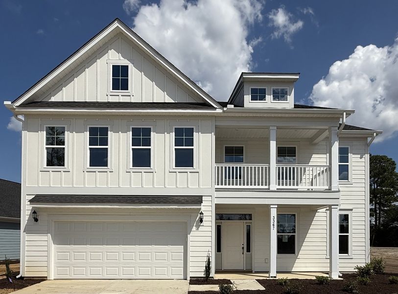 Front exterior of a new home in Grand Park, Leland, NC, highlighting curb appeal (Image 1).