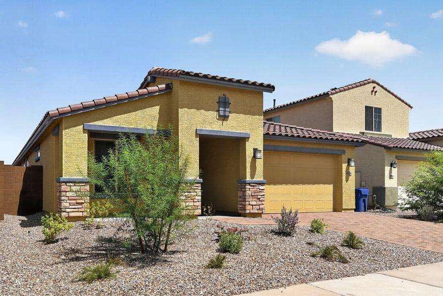Front exterior of a new home in Stonehaven, Glendale, AZ, highlighting curb appeal (Image 2). Front exterior of a new home in Stonehaven, Glendale, AZ, highlighting curb appeal (Image 2).