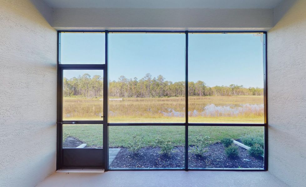 Exterior details and patio area of a home in Woodhaven, Port Orange (Image 16).