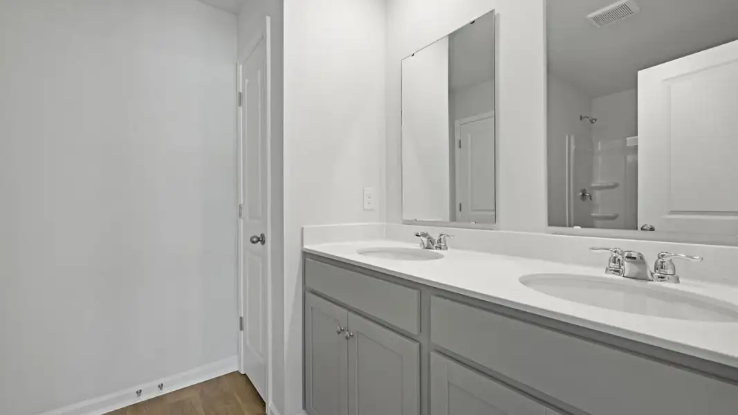 Furnished interior view inside a new home in Pine Hills Townhomes at Cane Bay, Summerville (Image 8). Furnished interior view inside a new home in Pine Hills Townhomes at Cane Bay, Summerville (Image 8).