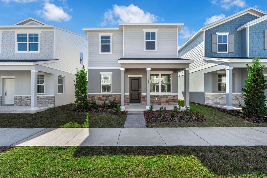 Front exterior of a new home in Brack Ranch, St. Cloud, FL, highlighting curb appeal (Image 27). Front exterior of a new home in Brack Ranch, St. Cloud, FL, highlighting curb appeal (Image 27).