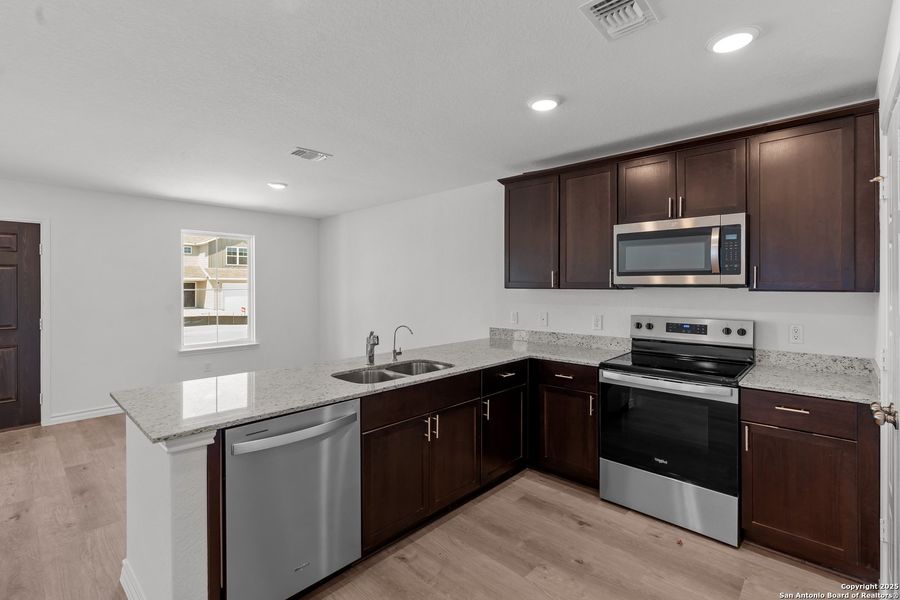 Furnished interior view inside a new home in Vista Real, Converse (Image 12).
