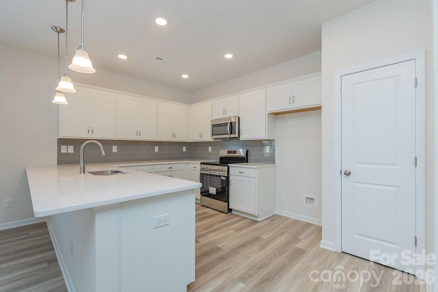 Furnished interior view inside a new home in Country Club Village, Salisbury (Image 8).