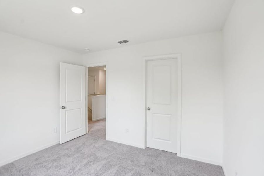 A room with white doors.