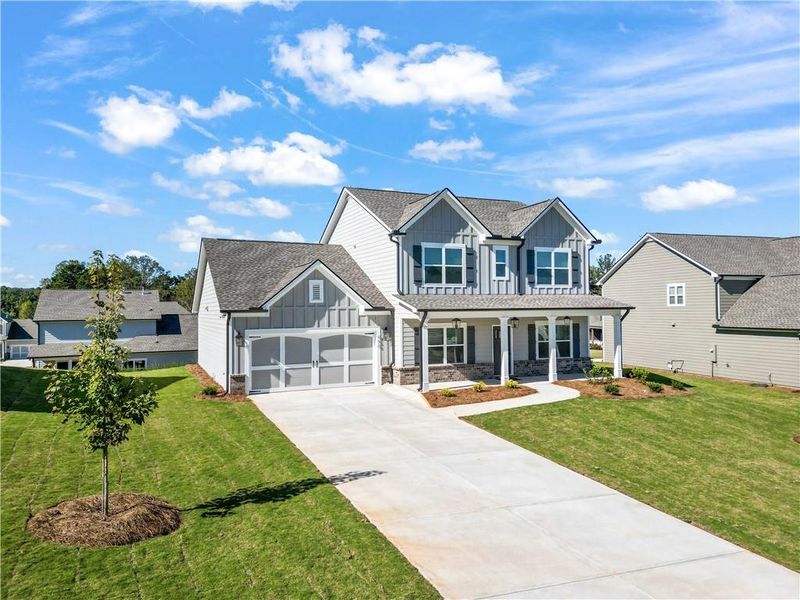 Front exterior of a new home in Calgary Downs, Winder, GA, highlighting curb appeal (Image 1).
