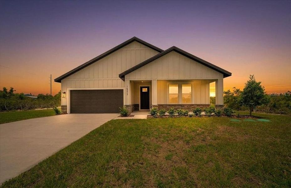 Front exterior of a new home in , Weeki Wachee, FL, highlighting curb appeal (Image 26). Front exterior of a new home in , Weeki Wachee, FL, highlighting curb appeal (Image 26).