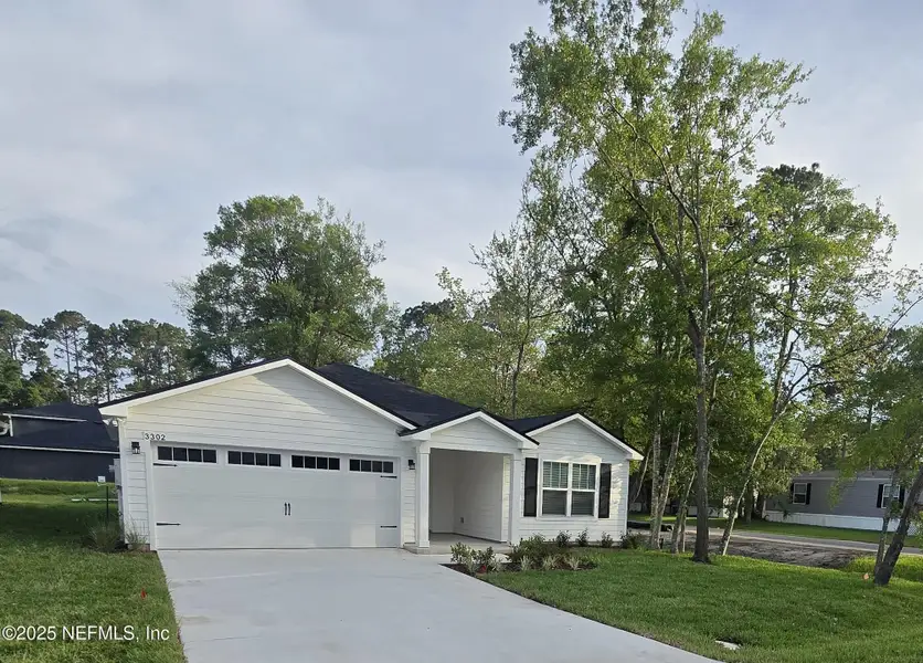 Front exterior of a new home in , Jacksonville, FL, highlighting curb appeal (Image 1). Front exterior of a new home in , Jacksonville, FL, highlighting curb appeal (Image 1).