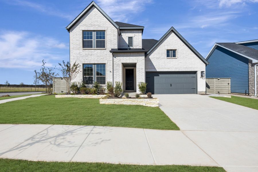 Front exterior of a new home in Treeline, Justin, TX, highlighting curb appeal (Image 1).