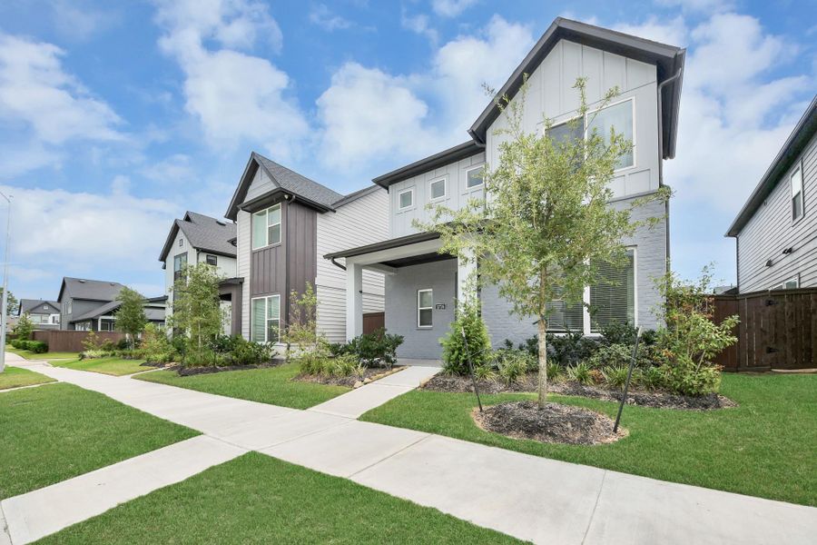 Front exterior of a new home in The Groves 35', Humble, TX, highlighting curb appeal (Image 30). Front exterior of a new home in The Groves 35', Humble, TX, highlighting curb appeal (Image 30).