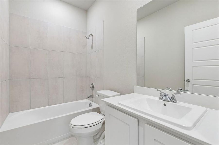 Bathroom in the Emmy II home plan by Trophy Signature Homes - REPRESENTATIVE PHOTO