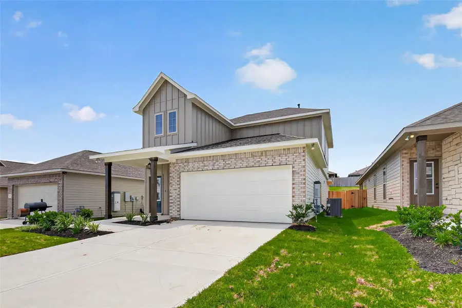 Front exterior of a new home in Mostyn Springs, Magnolia, TX, highlighting curb appeal (Image 2). Front exterior of a new home in Mostyn Springs, Magnolia, TX, highlighting curb appeal (Image 2).