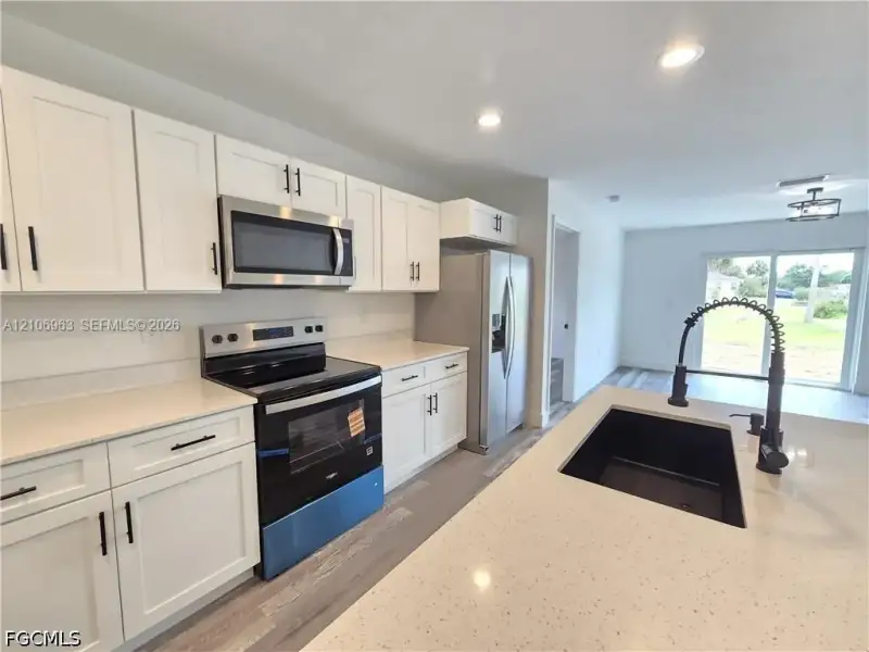 Furnished interior view inside a new home in , Port Charlotte (Image 11).