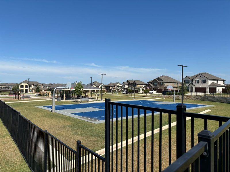 View of pool with basketball court and a residential view View of pool with basketball court and a residential view