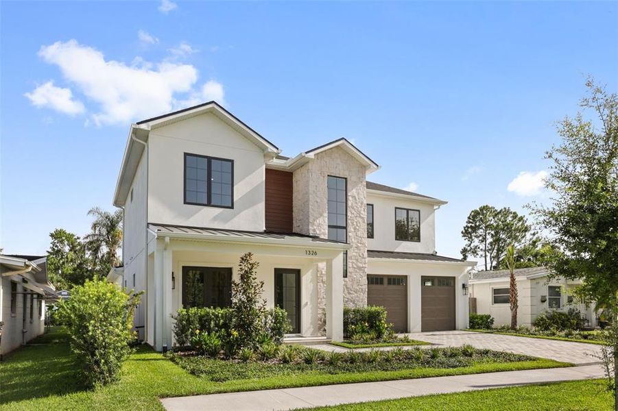 Front exterior of a new home in College Park, Orlando, FL, highlighting curb appeal (Image 2). Front exterior of a new home in College Park, Orlando, FL, highlighting curb appeal (Image 2).