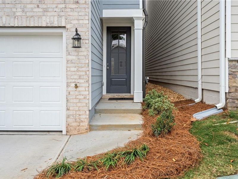 Exterior details and patio area of a home in The Village at Shallowford, Kennesaw (Image 1). Exterior details and patio area of a home in The Village at Shallowford, Kennesaw (Image 1).